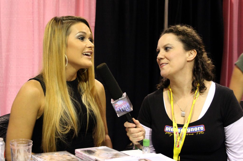 Justine Hartel doing an interview at Exxxotica 2015.